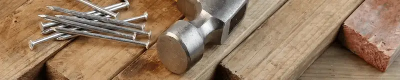 Hammer and nails on hardwood flooring boards in Saint Petersburg, FL
