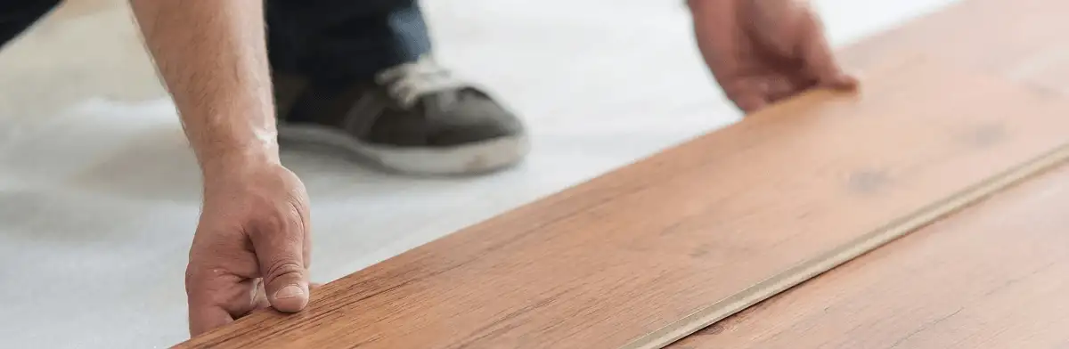 A professional installing laminate flooring in Saint Petersburg, FL